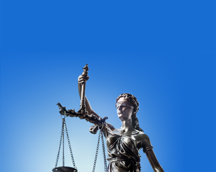 Themis, the goddess of justice, holds a scale in her right hand, with a white gleam behind her that seamlessly merges with the light blue background.